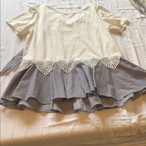 Small Cream colored blouse with a ruffled pattern